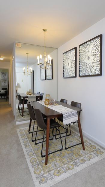 dining room with a table and chairs in a home at Village of Pine Run Apartments & Townhomes*, Baltimore